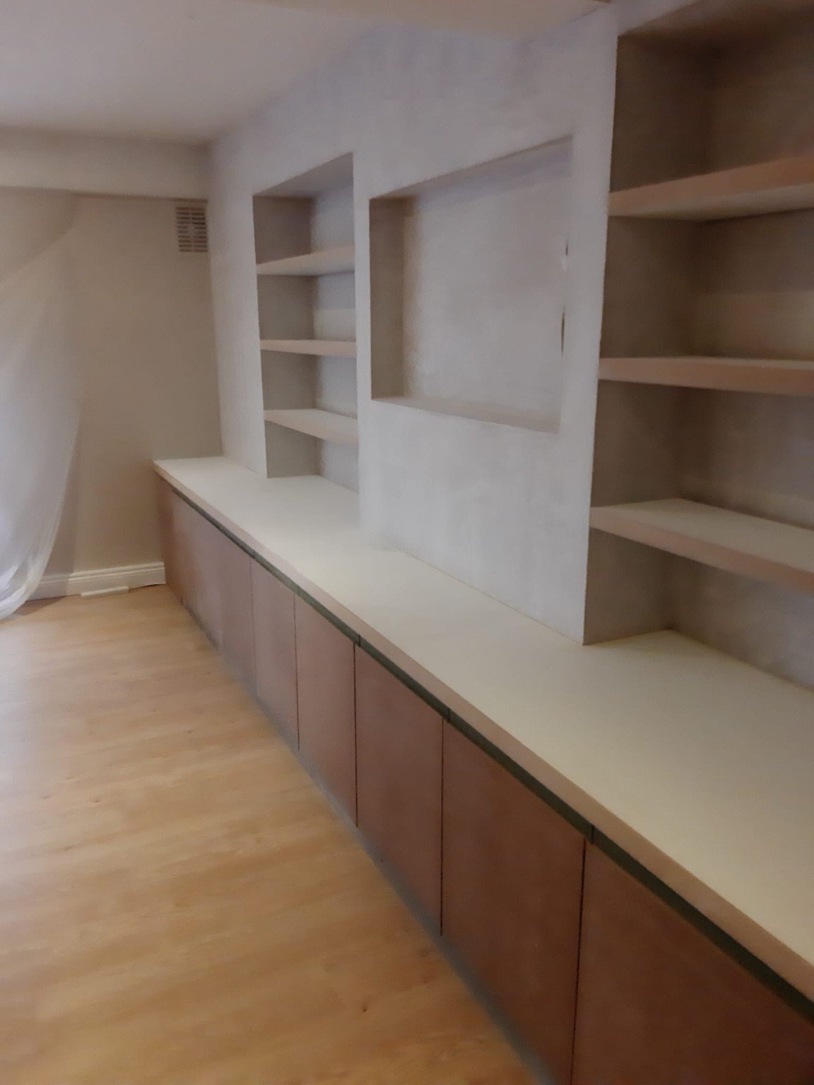 Built-in media wall and shelving carpentry